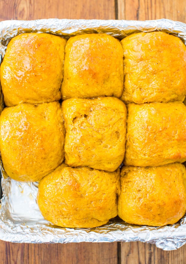 Honey Butter Pumpkin Dinner Rolls - Big, soft rolls brushed with honey butter are the best! Everyone loves them and they disappear so fast!