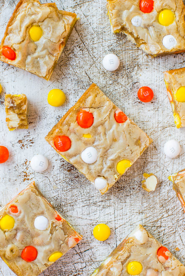 Candy Corn White Chocolate M&M's Blondies — Seasonal white chocolate M&M's are studded through these M&M's blondies. The perfect Halloween dessert for adults AND kids!