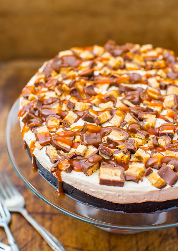 no bake snickers pie on glass cake stand