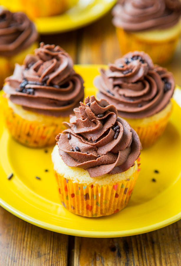 Yellow Cupcakes with Chocolate Buttercream Frosting — These from-scratch yellow cupcakes with chocolate buttercream frosting taste just like the kind you grew up eating at childhood birthday parties!