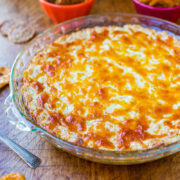 A freshly baked cheese-topped casserole in a glass dish.