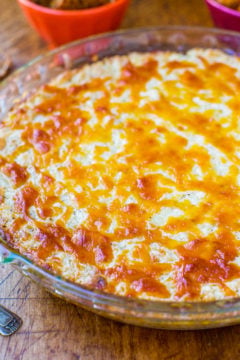 A freshly baked cheese-topped casserole in a glass dish.