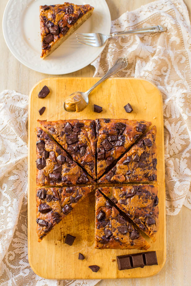Peanut Butter Chocolate Chunk Banana Cake - An easy, one-bowl, no mixer cake that's drenched with peanut butter and loaded with chocolate! Recipe at averiecooks.com