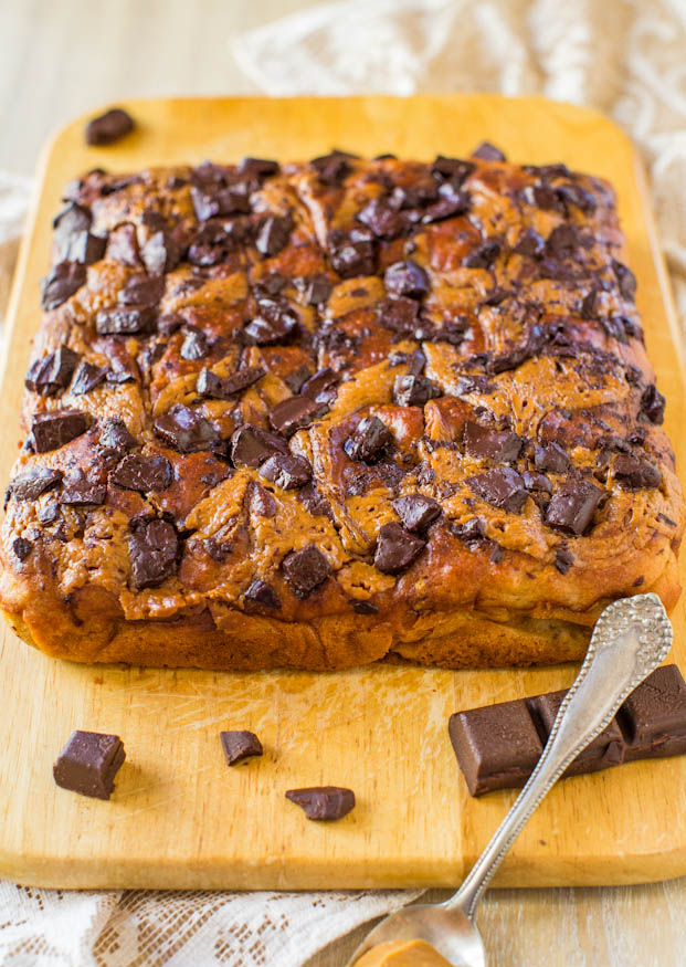 Peanut Butter Chocolate Chunk Banana Cake - An easy, one-bowl, no mixer cake that's drenched with peanut butter and loaded with chocolate! Recipe at averiecooks.com