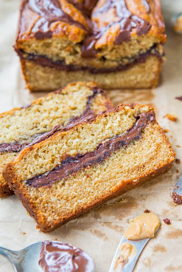 Nutella Peanut Butter Bread — Easy, no-mixer quick bread baked in a loaf pan that tastes like cake! Nutella is swirled inside and on top of the peanut butter bread, because why not?!