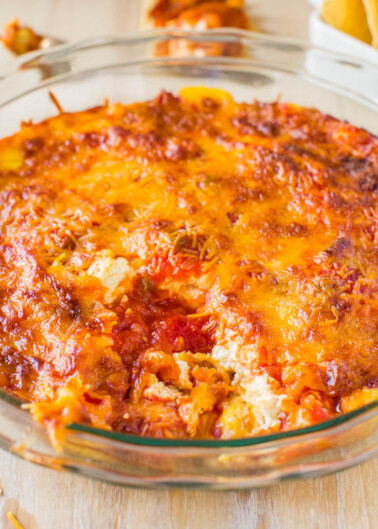 A baked lasagna in a glass dish with a golden-brown cheese crust.