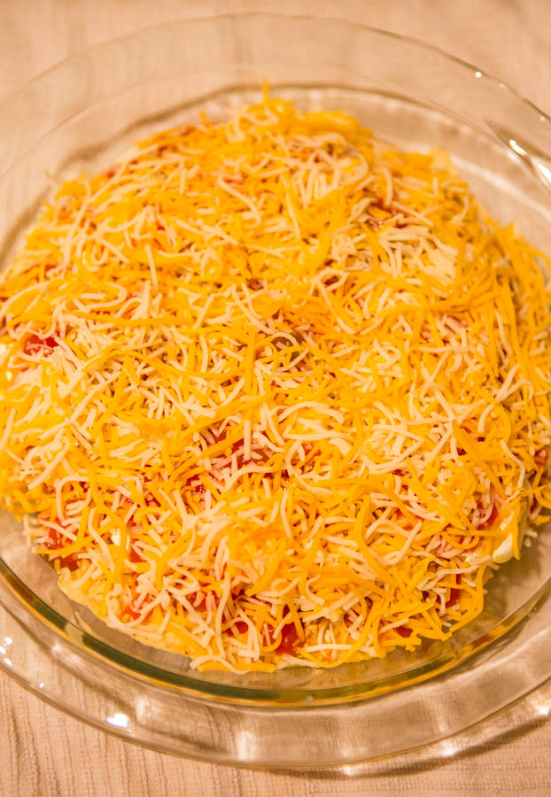 Baked Triple Cheese & Salsa Tortilla Chip Dip - Loaded with 3 kinds of cheese & baked to browned, bubbly, golden perfection! Always a hit at parties & great for Superbowl! Easy recipe at averiecooks.com