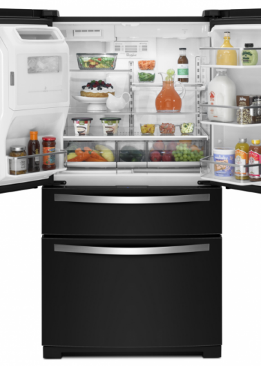 A modern french-door refrigerator with the top doors open, revealing a neatly organized interior with various foods and condiments.