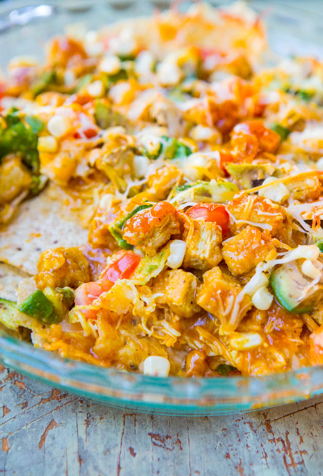 Loaded BBQ Chicken Nugget Nachos (with vegan/GF options) - Chicken nuggets coated in BBQ sauce on top of cheesy nachos. Perfect party food!