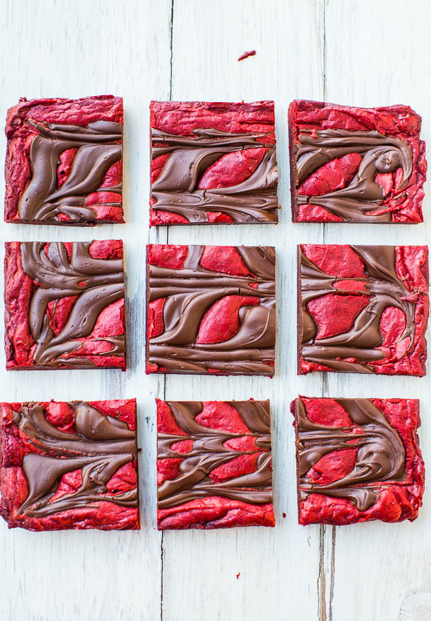 Red Velvet Chocolate-Swirled Brownie Bars {from scratch, not cake mix} - These easy bars topped with an abundance of chocolate are velvety soft and smooth! They don't call it red velvet for nothing! 