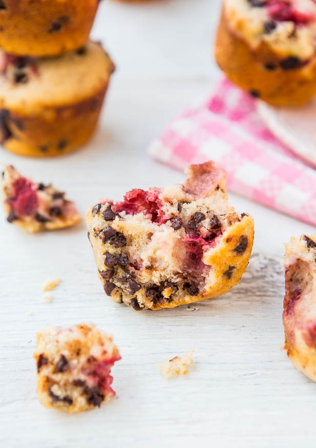 chocolate chip strawberry muffin torn in half on countertop