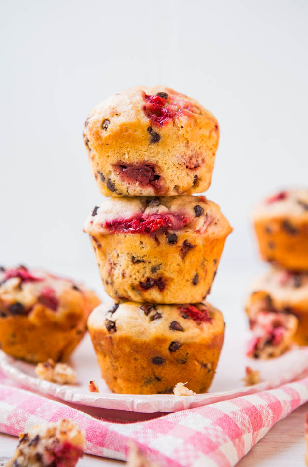 stack of three chocolate chip strawberry muffins on tea towel