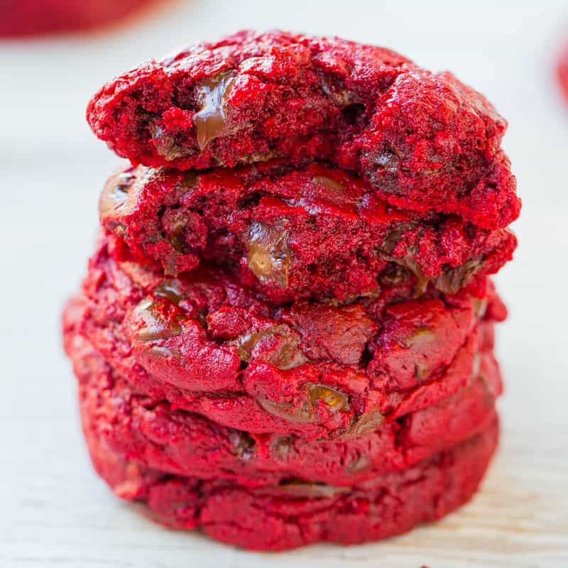 A stack of red velvet cookies with chocolate chips.
