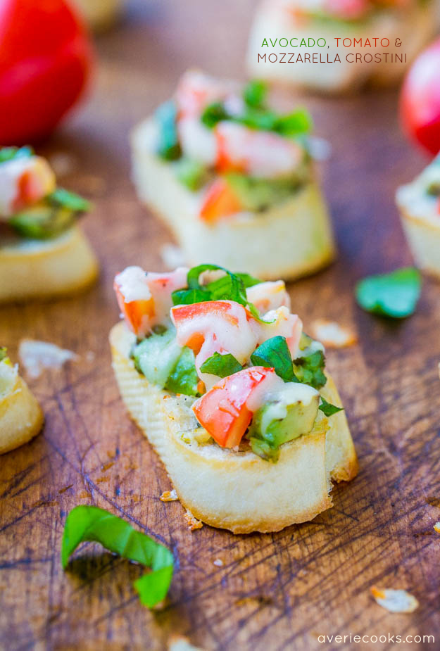 Avocado, Tomato, and Mozzarella Crostini - Like bruschetta, but with avocado & who can say no to avocado and cheese! A fast & easy appetizer everyone loves & ready in 15 minutes!