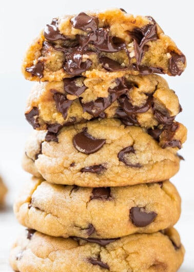A stack of chocolate chip cookies on a white background.