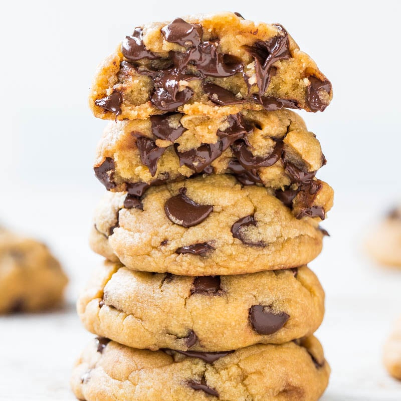 A stack of chocolate chip cookies on a white background.