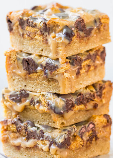 Stack of blondies with chocolate chunks and caramel drizzle.