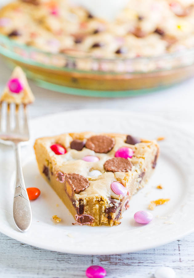 Soft and Chewy Loaded Candy Bar Pie — If you like M&M's cookies, you'll love this biggie version! Super easy and loaded with M&M's, Rolos, PB cups, and more!