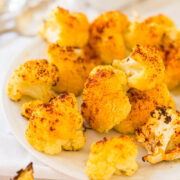 Roasted cauliflower florets on a white plate.