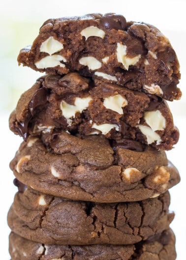 A stack of chocolate cookies with white chocolate chips.