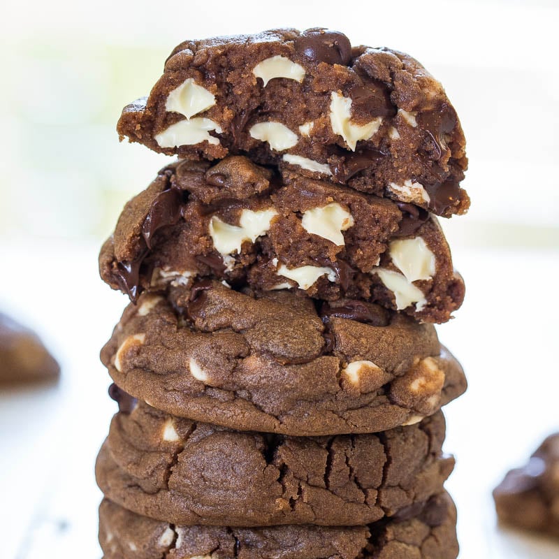A stack of chocolate cookies with white chocolate chips.