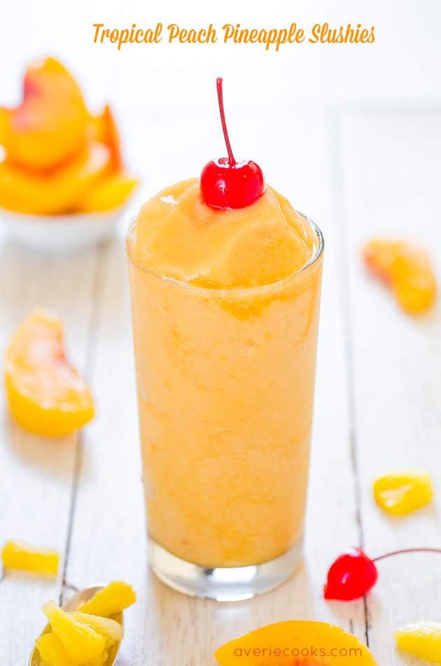 Tropical Peach Pineapple Slushie garnished with a cherry