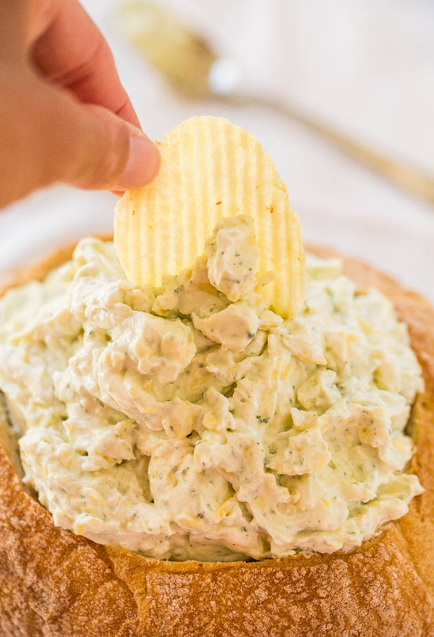 Creamy Ranch and Cheese Bread Bowl Dip - A no-bake, easy dip that's packed with bold flavor! A perfect party dip & you get to eat the bowl!