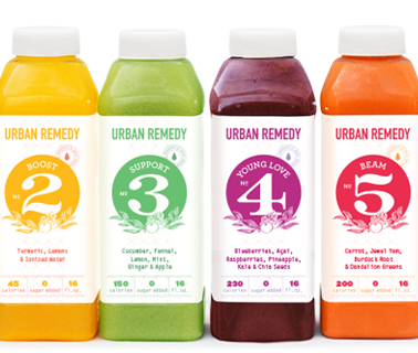 A collection of six colorful urban remedy juice bottles with numbered labels indicating different flavors and ingredients.
