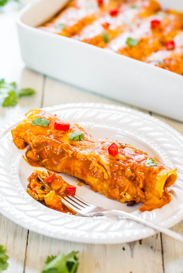 sweet potato and black bean enchilada on white plate with fork