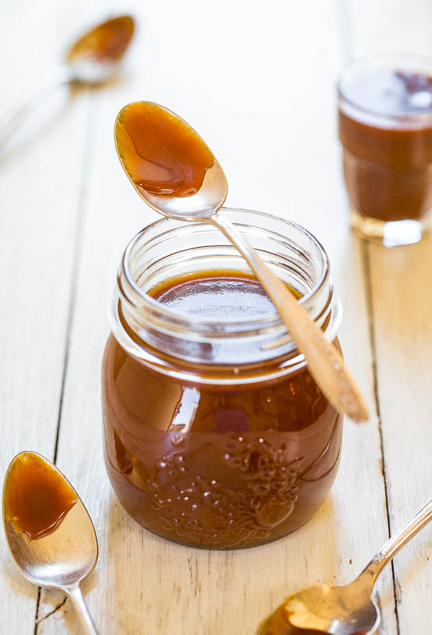 Salted Caramel Sauce in jar with spoon on top