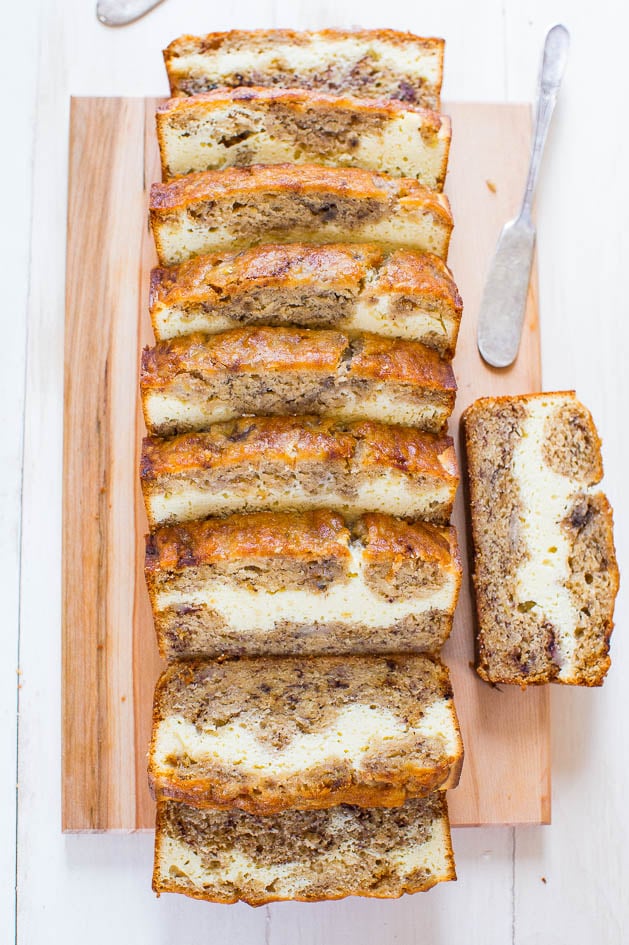 Cream Cheese-Filled Banana Bread — This is the BEST homemade banana bread recipe! This banana bread tastes like it has cheesecake baked in! Soft, fluffy, easy and tastes ahhhh-mazing!!