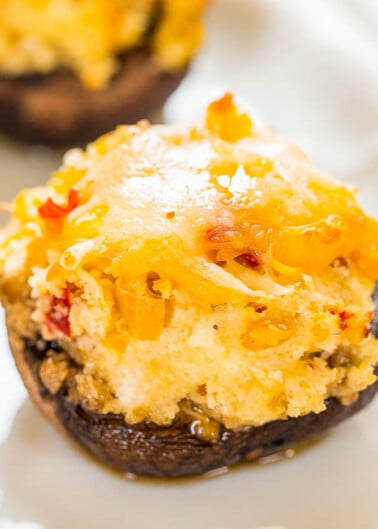 A stuffed mushroom topped with melted cheese.