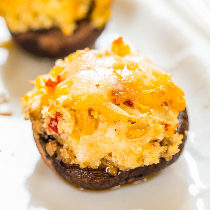 A stuffed mushroom topped with melted cheese.