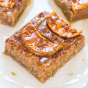 A slice of caramel apple blondie on a white plate.