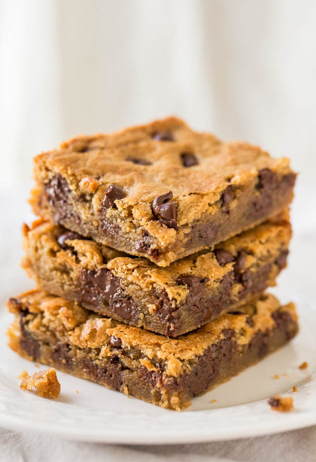 stack of peanut butter chocolate chip bars on white plate