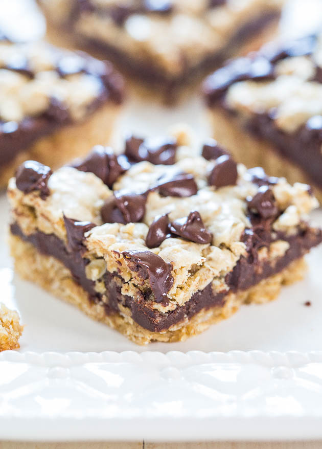 Fudgy Oatmeal Chocolate Chip Bars — Chewy oatmeal cookie bars with a thick layer of fudge in the middle! Whoa, hello chocolate overload!!