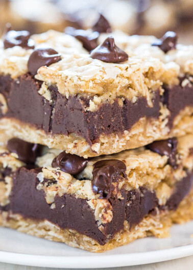 Stack of chocolate fudge bars with oatmeal crumble topping and chocolate chips.