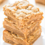 A stack of freshly baked, crumbly peanut butter bars.