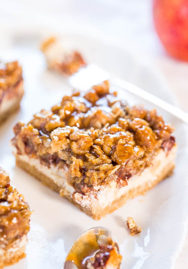 Caramel Apple Cheesecake Bars on white plate with fork