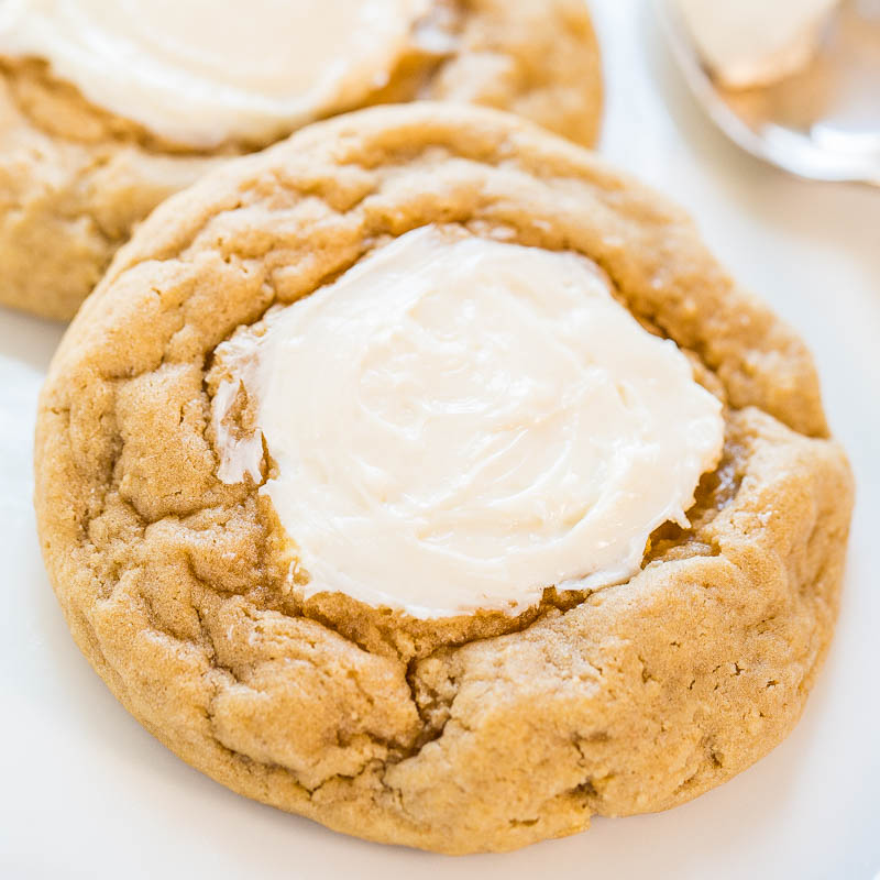 Freshly baked cookies topped with a dollop of creamy frosting.
