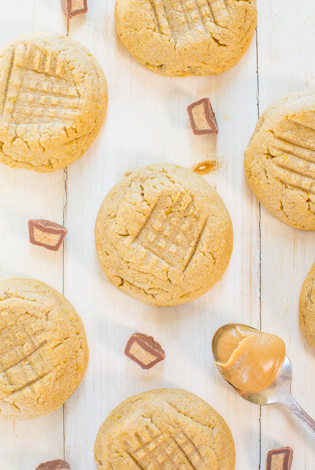 overhead view of six soft peanut butter cookies surrounded by PB cups 