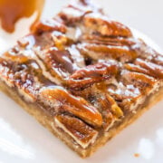 A pecan bar with caramel topping and sea salt flakes.