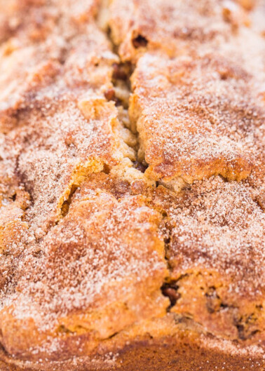 Close-up of a cinnamon sugar-dusted loaf of bread.