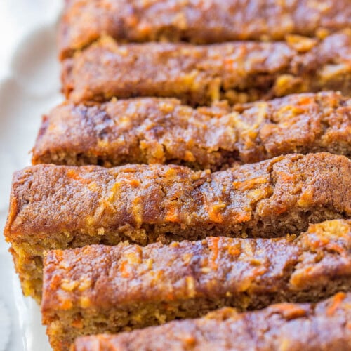 Sliced carrot apple bread on a plate.