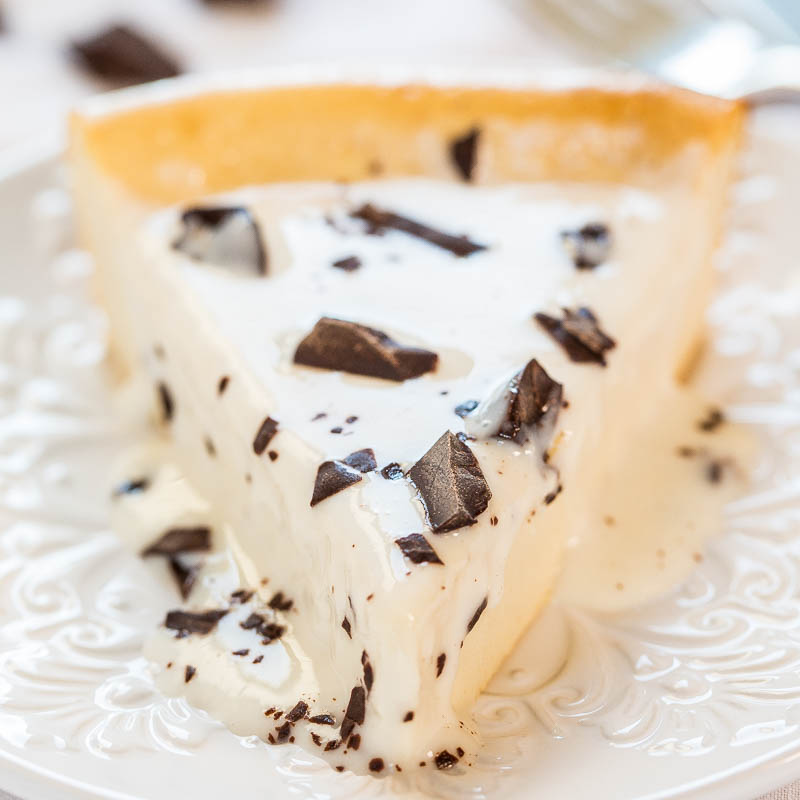 A slice of chocolate chip cheesecake on a decorative plate.