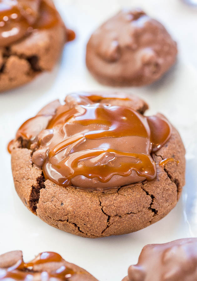 Chocolate Peanut Butter Turtle Cookies - Soft and chewy cookies with a Turtle in the middle and drizzled with salted caramel!! So.darn.good.