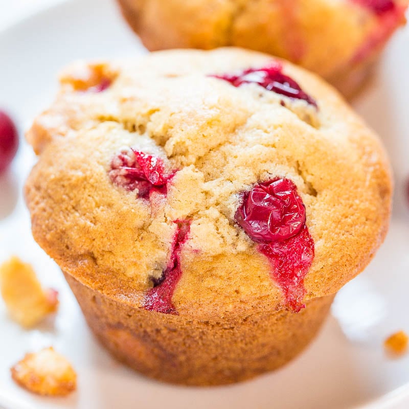 Freshly baked raspberry muffin with visible berries.