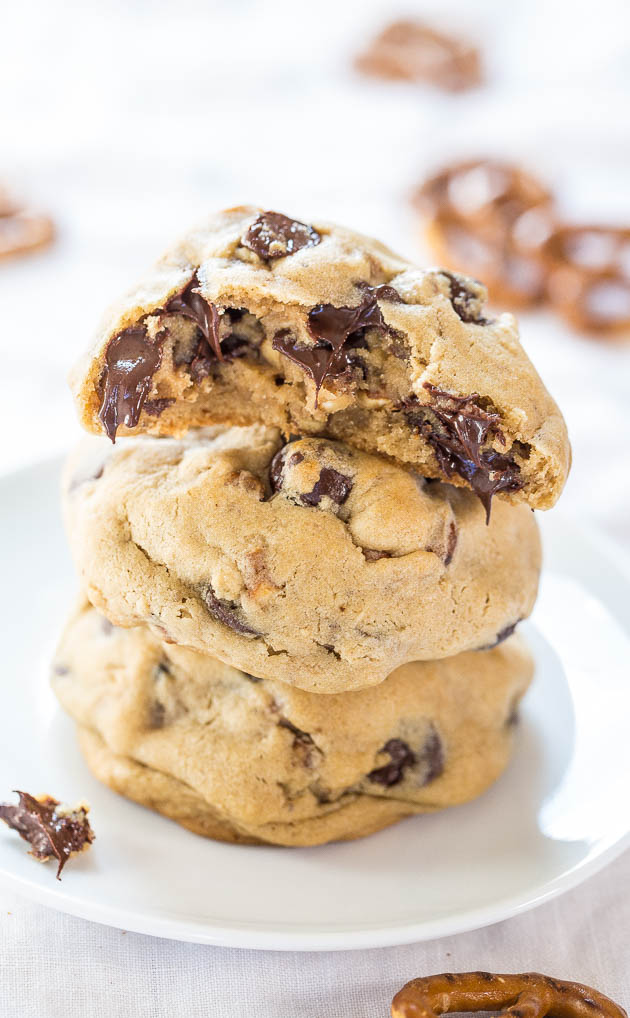 stack of three chocolate chip pretzel cookies on a white plate 