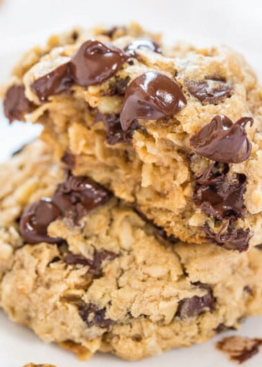 A stack of homemade chocolate chip cookies on a plate.
