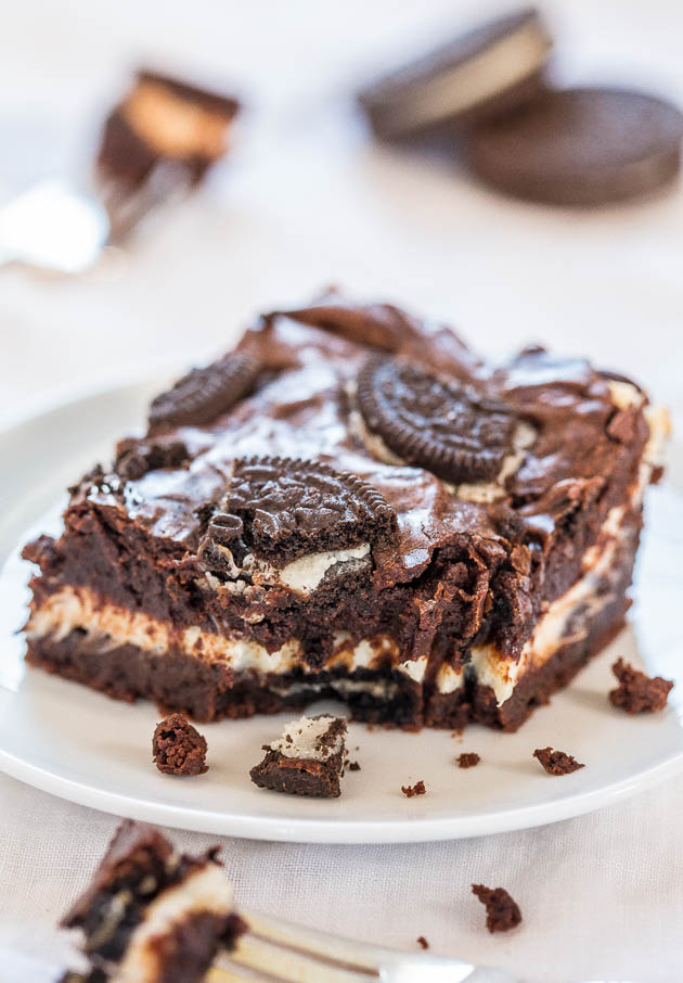 Oreo Cream Cheese Brownie on white plate with bite missing